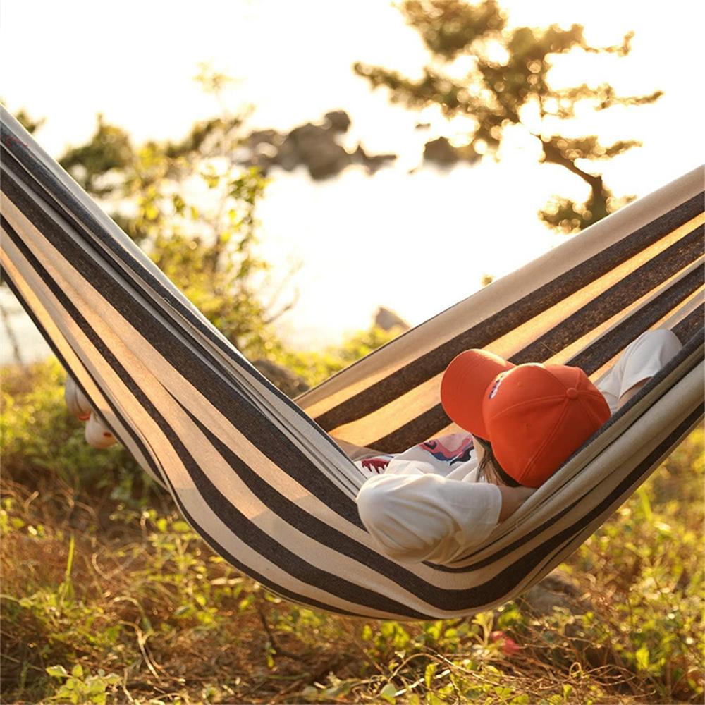 Brazilian double hammock with thick cotton canvas and reinforced ropes, ideal for commercial camping and resort outdoor relaxation